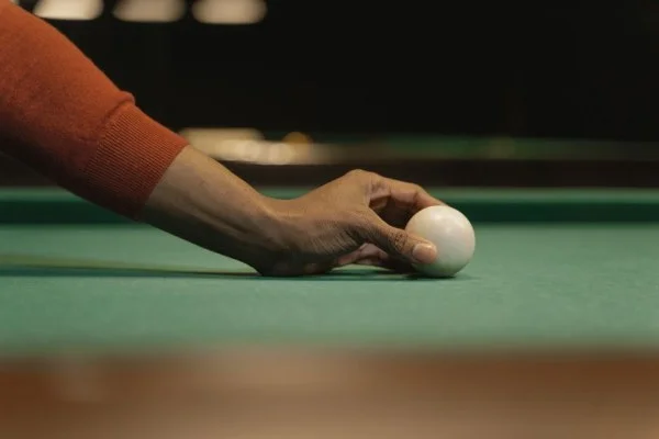 snooker player holding cue